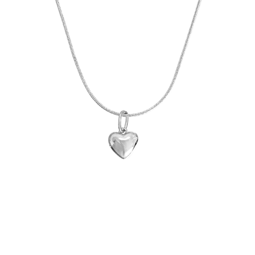 silver necklace with heart charm on white background